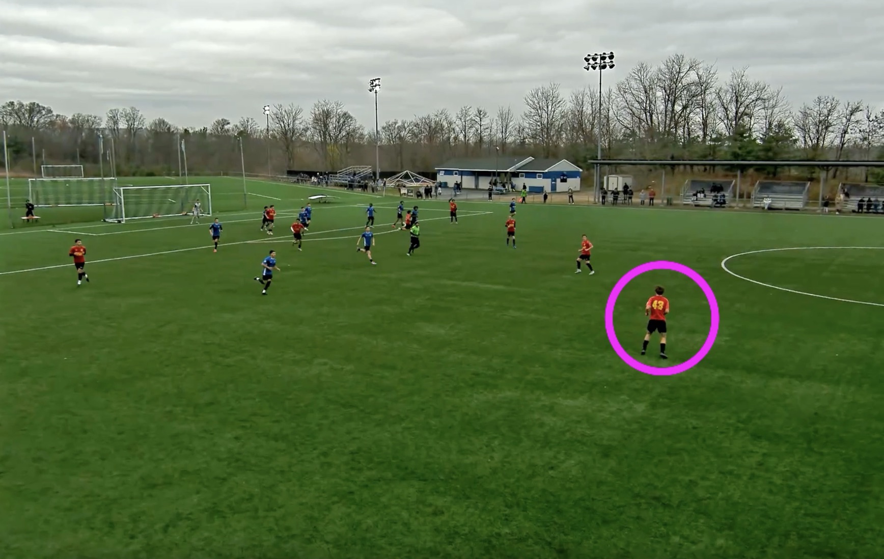 The same frame in the exported clip: video frozen with a circle highlight drawn around one player